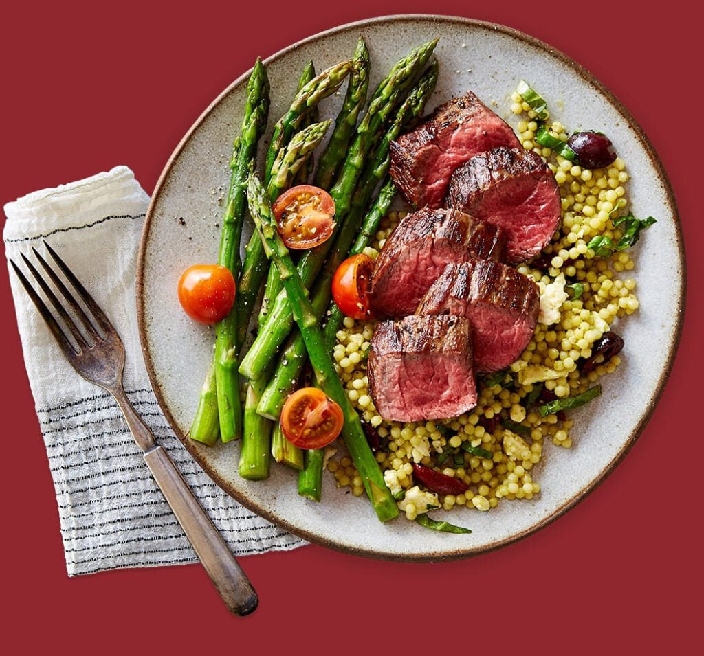 Delicious Gobble dinner including steak and asparagus