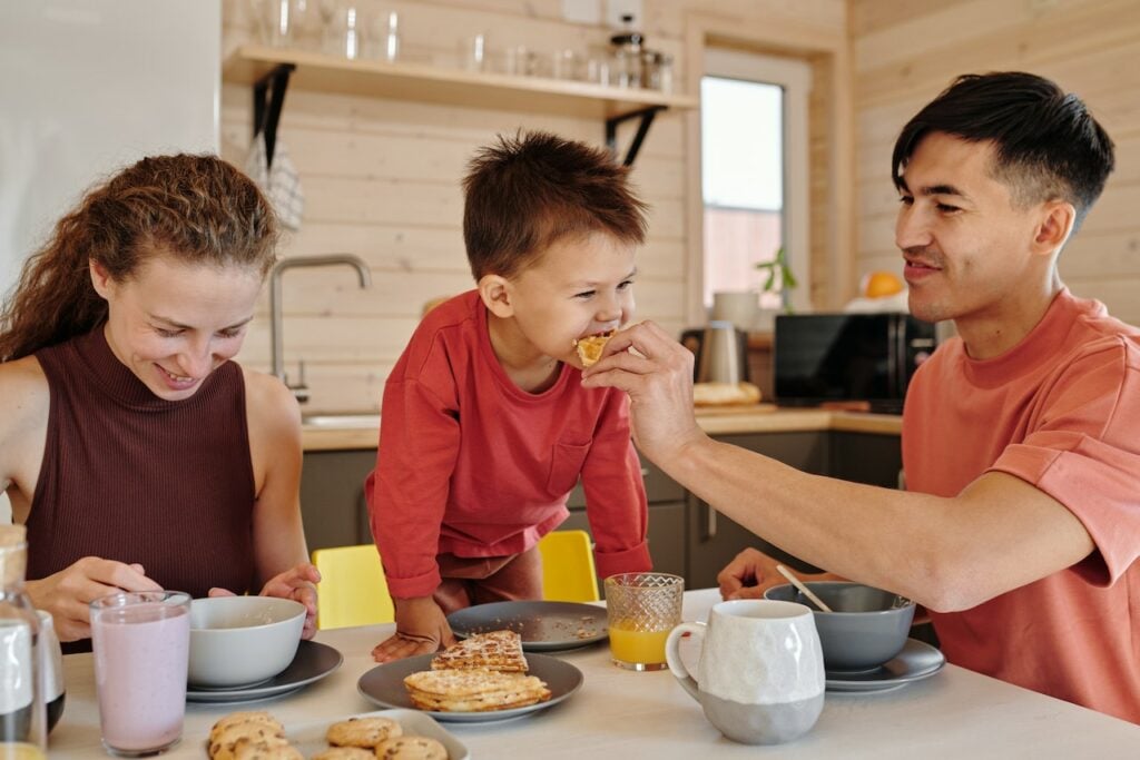 Family eating breakfast at the table