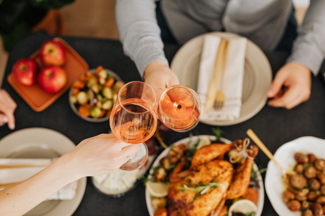 Food on the table with two people having wine