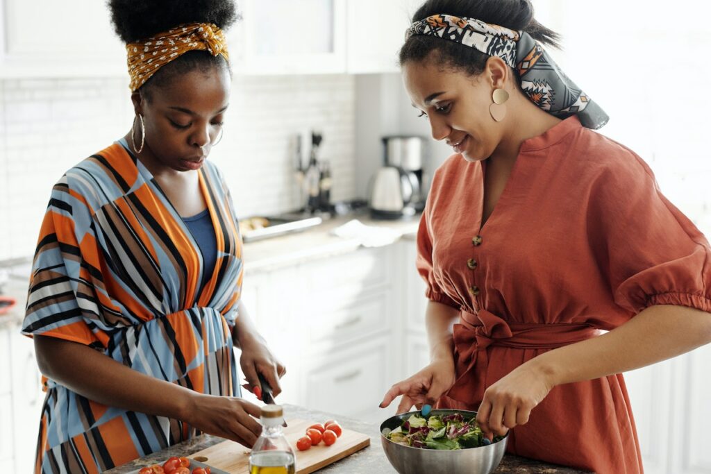 two women making a salad